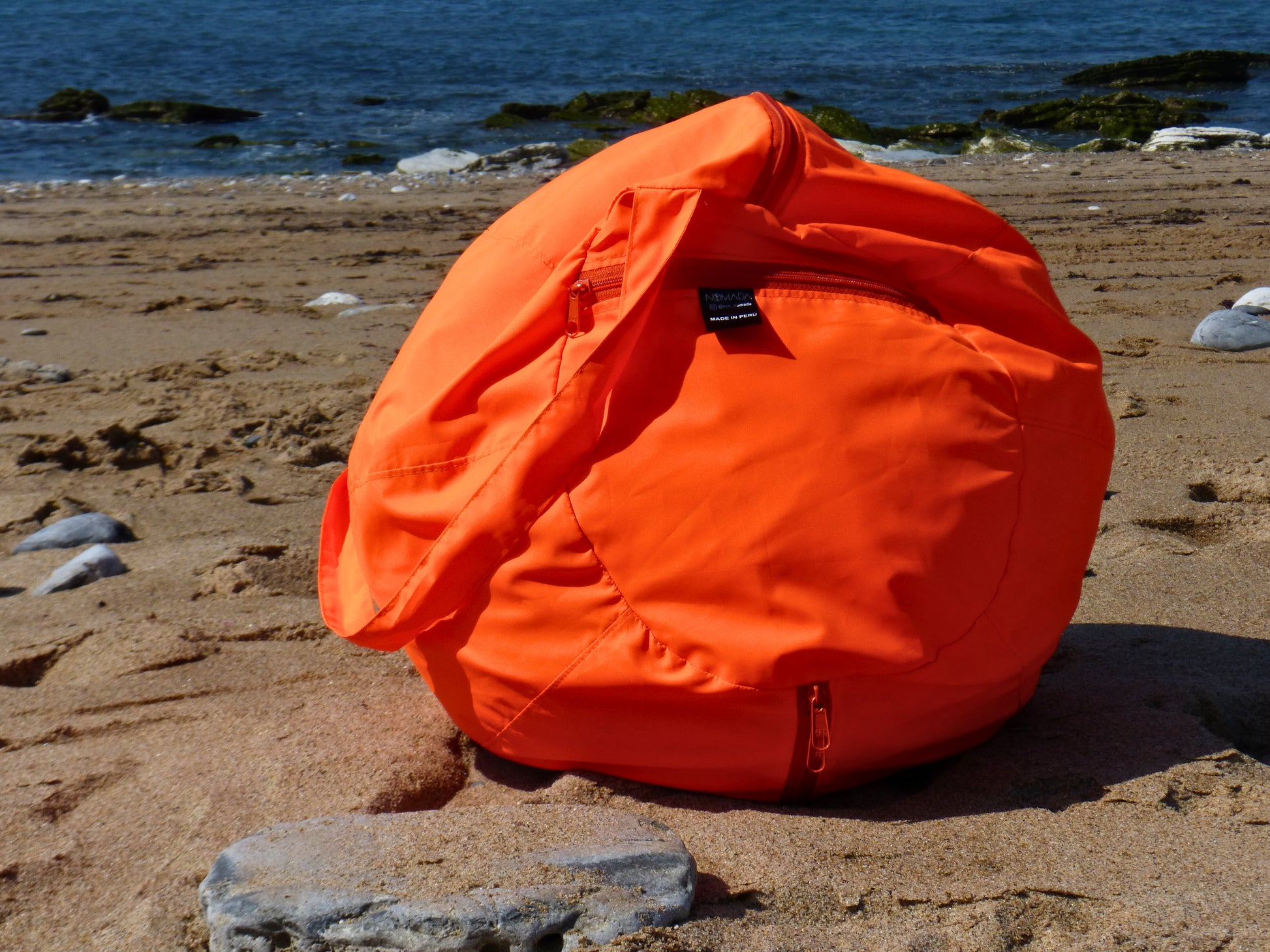 Coussin de plage orange avec anse