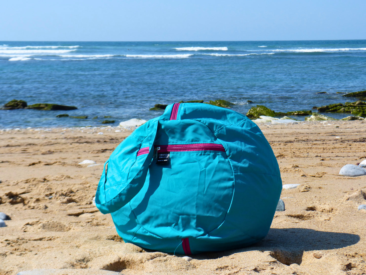 Coussin de plage turquoise avec anse